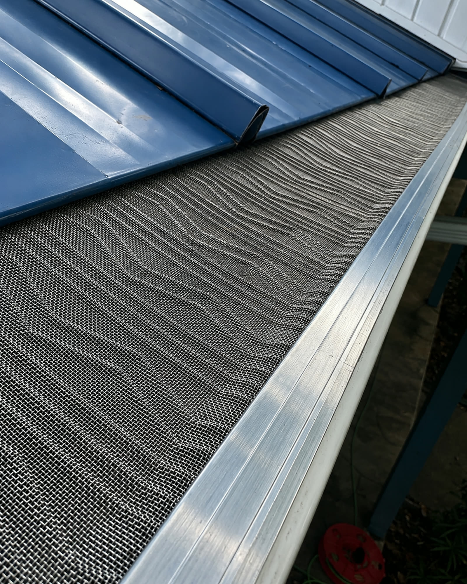Micro-mesh gutter guard installed on a gutter