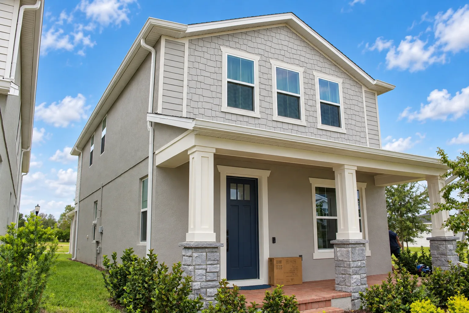 Two-story home with white seamless gutters in Apopka, FL