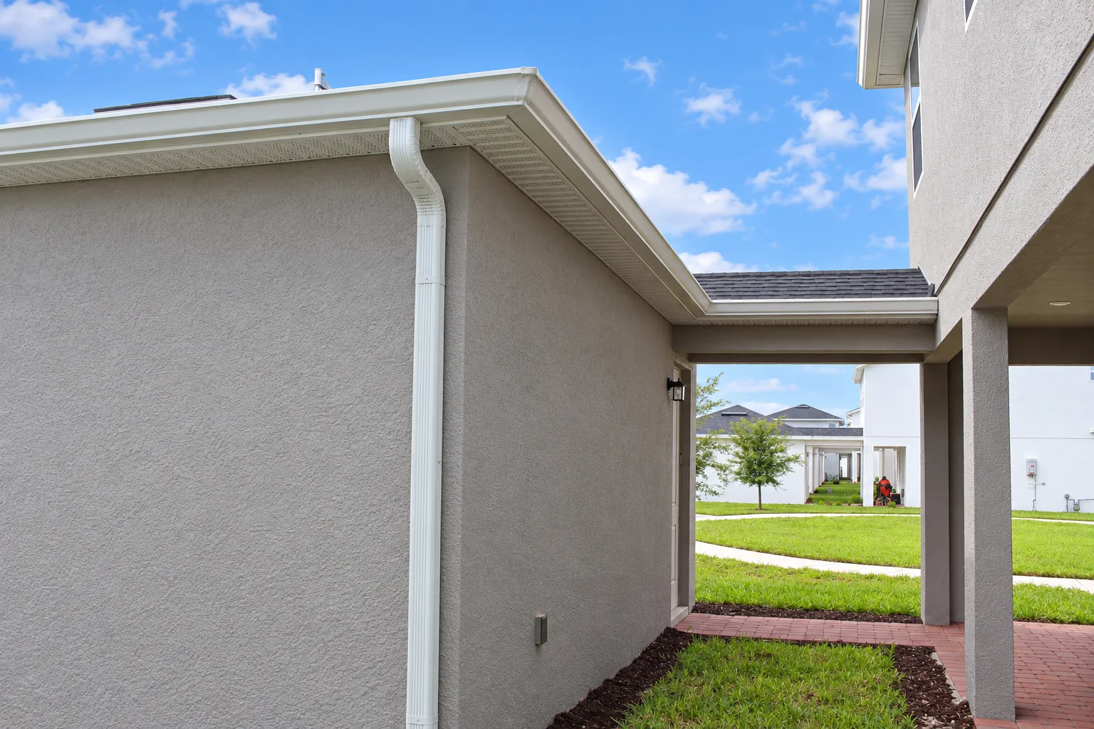 White gutters and downspout on the back of a home in Apopka, FL