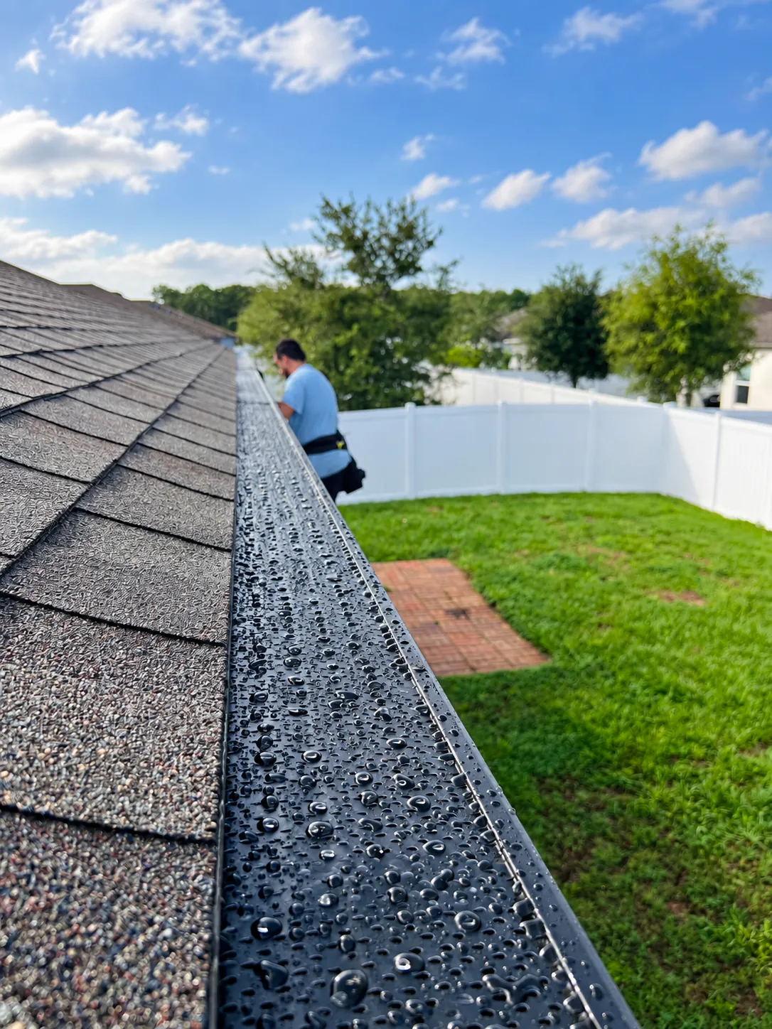 Gutters C2U installer fitting gutter guards on a home in Deltona, FL