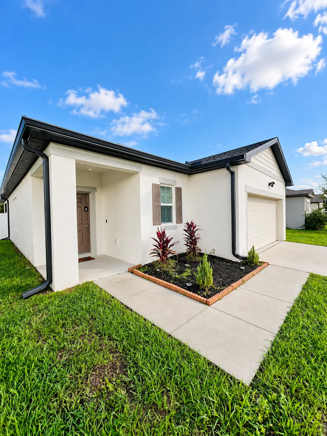 Seamless gutters on a new single-story home in Deltona, FL
