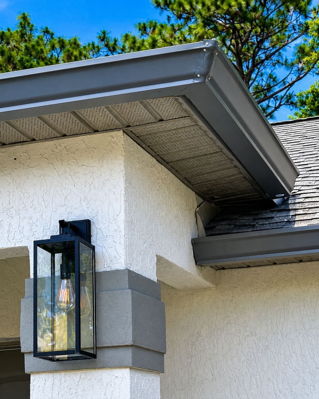 Gutter corner and downspout detail on a stucco home in Central Florida