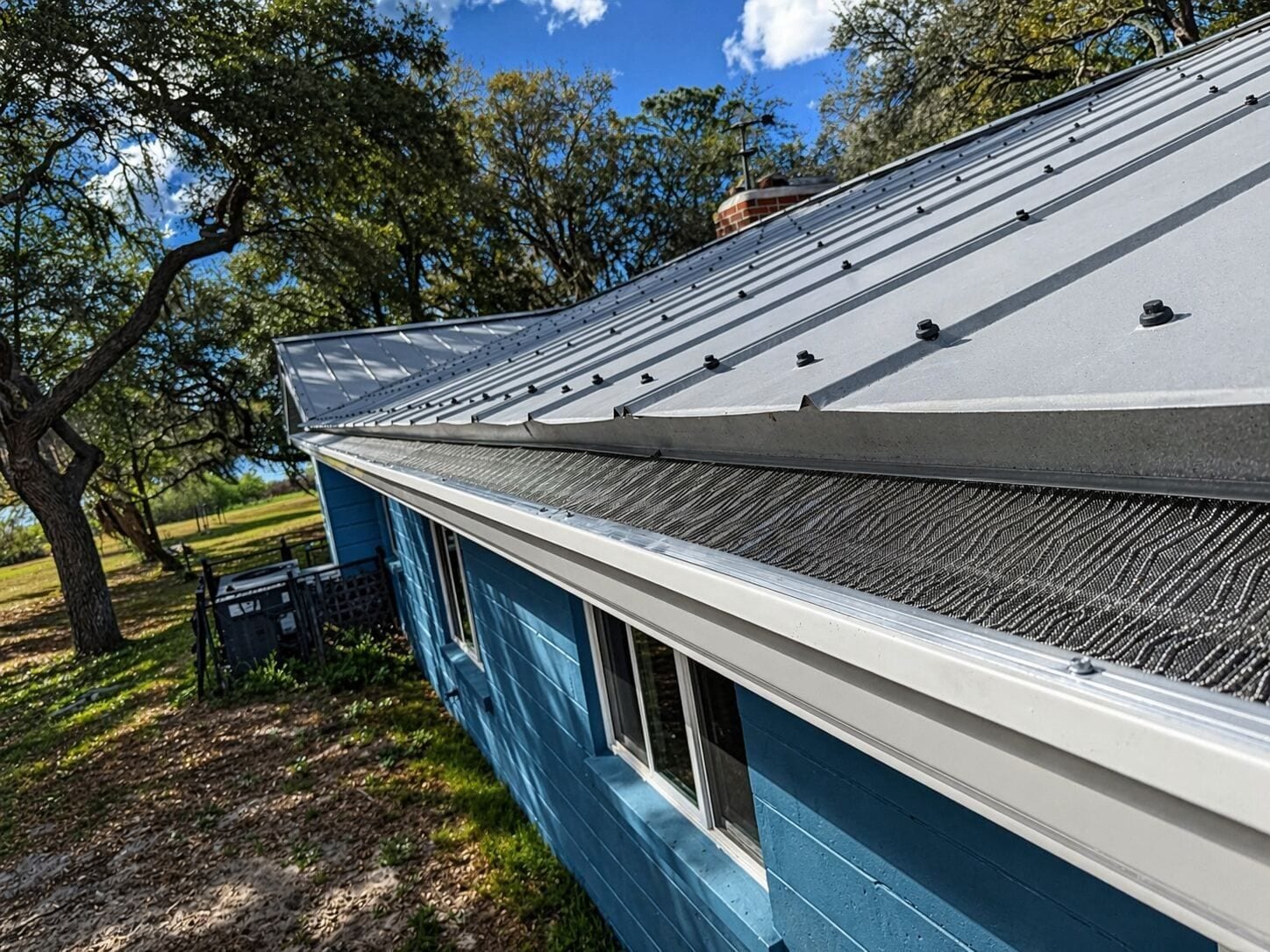 Gutter guards installed on a metal roof in Central Florida