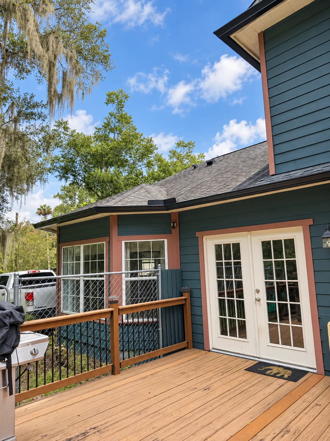 Black seamless gutters over a backyard deck in Oviedo, FL