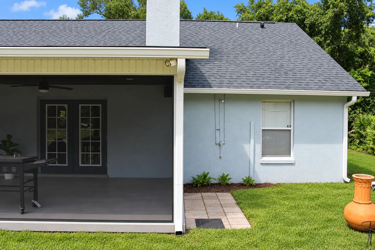 White seamless gutters on the back of a home in Oviedo, FL